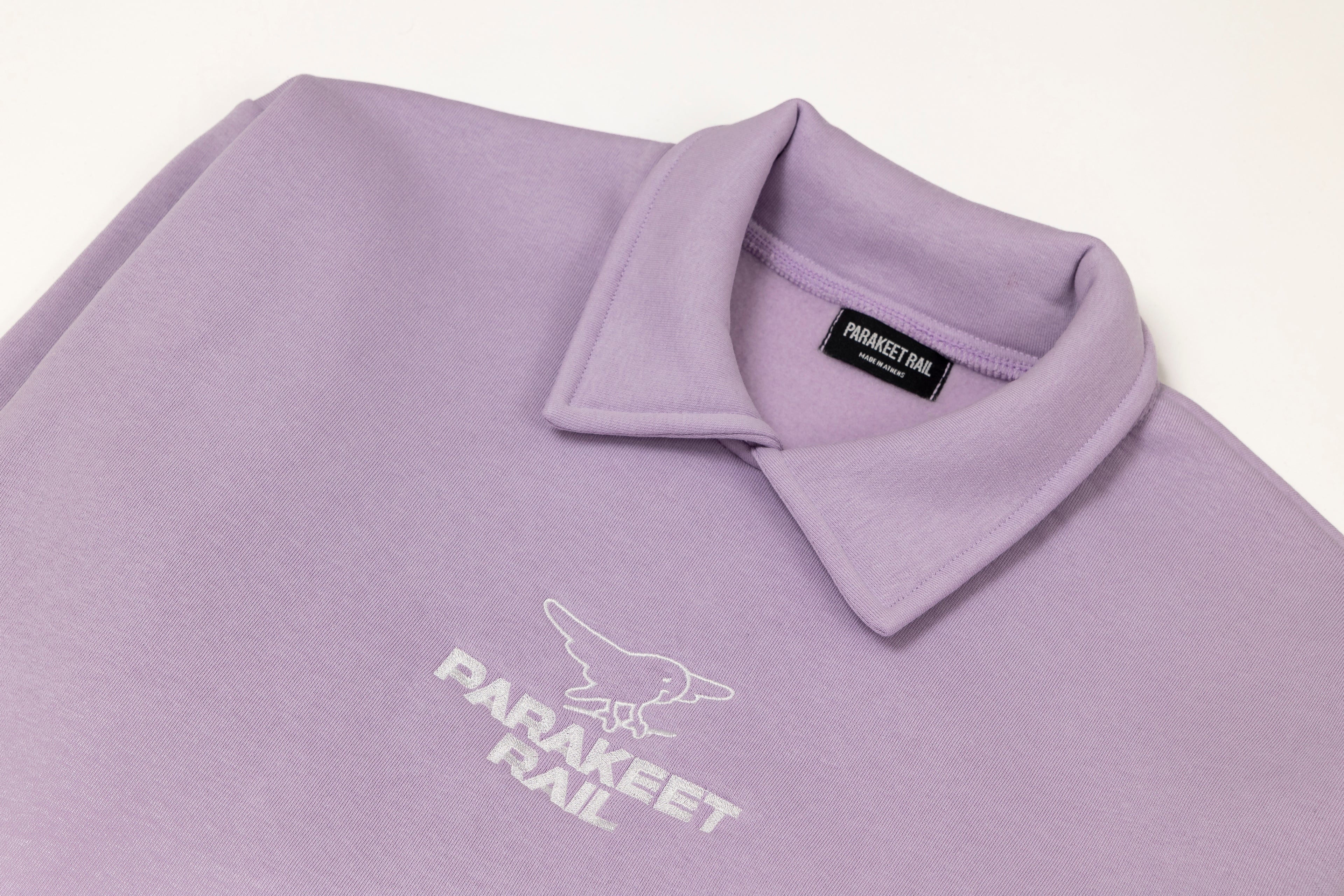 Parakeet Rail's pink crop top shown from the front.